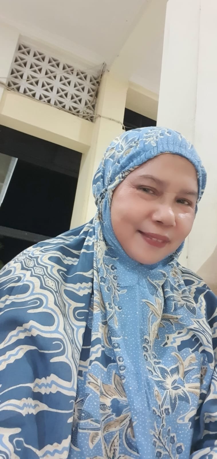 Hj. Gusni Rahman Arifin